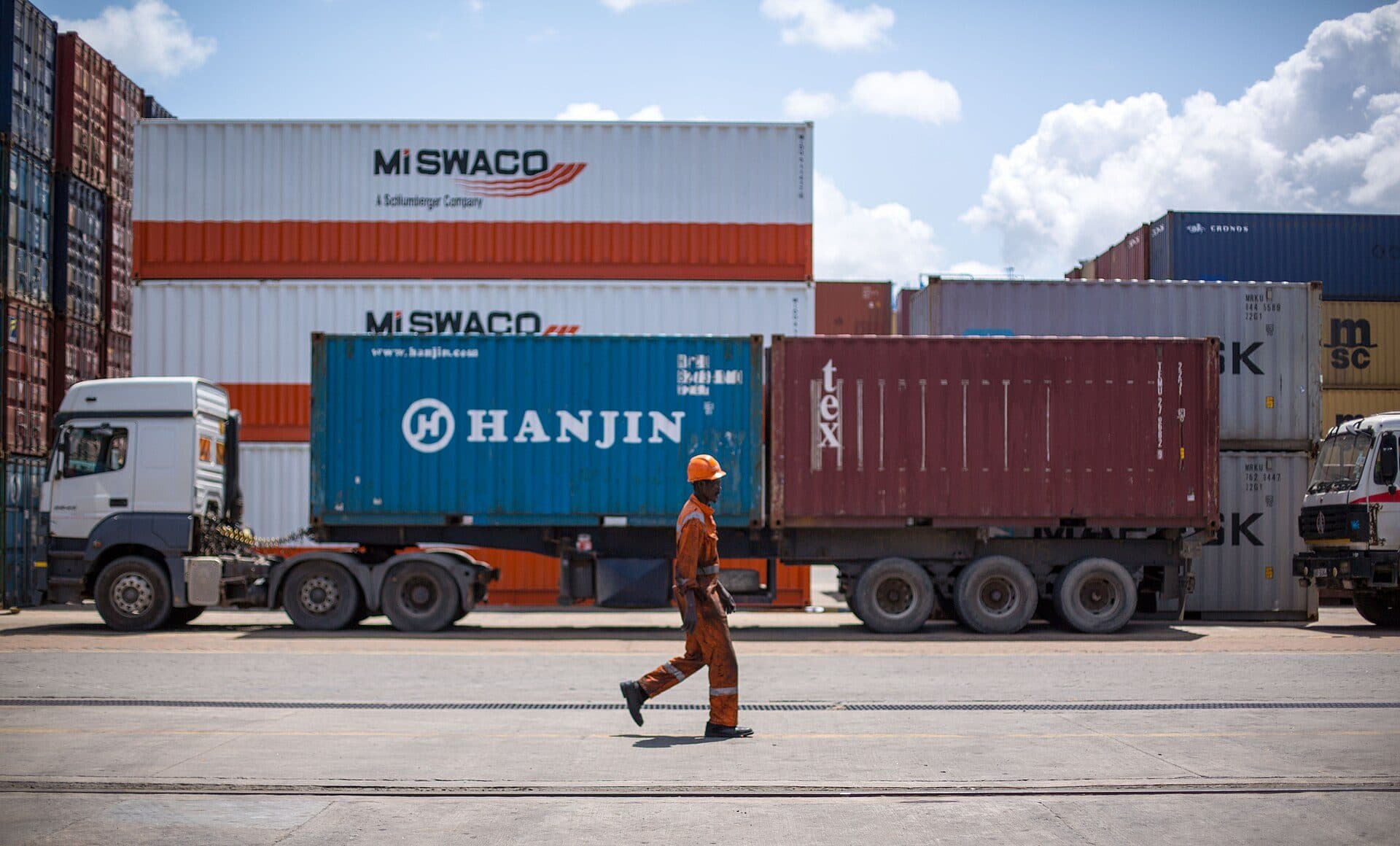 Container truck and a dock worker at the Port of Mombasa